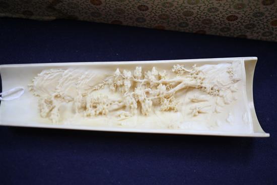 A pair of Chinese ivory wrist rests, early 20th century, 20.5cm, silk brocade covered stands